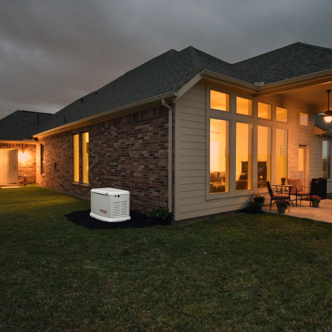 Generac Generator outside of home at night 